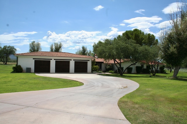 exterior space featuring a lawn and a garage
