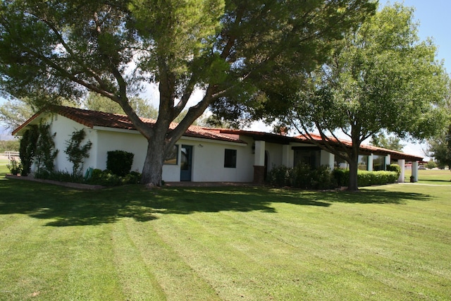 exterior space with a yard