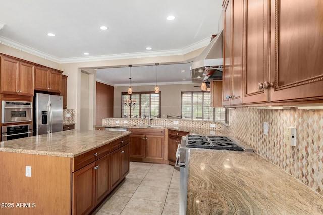 kitchen featuring light stone counters, stainless steel appliances, a sink, range hood, and brown cabinets