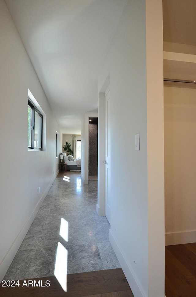 corridor with wood-type flooring