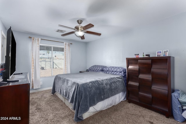 bedroom featuring light carpet and ceiling fan