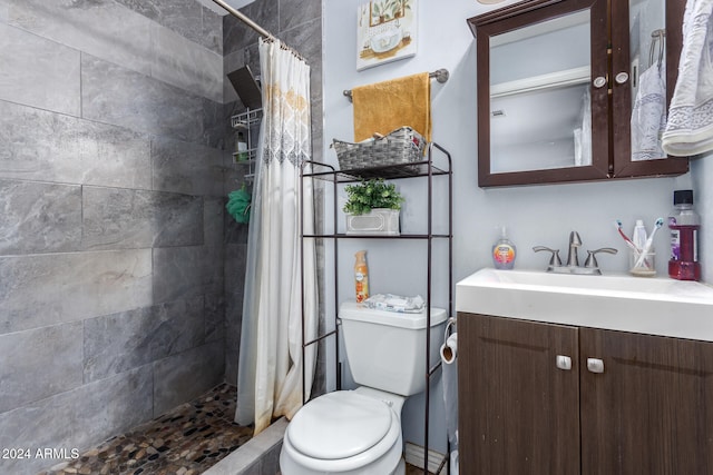 bathroom featuring vanity, toilet, and walk in shower