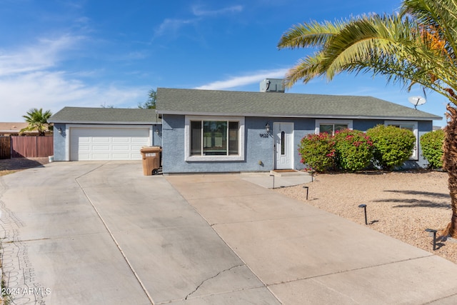 single story home with a garage