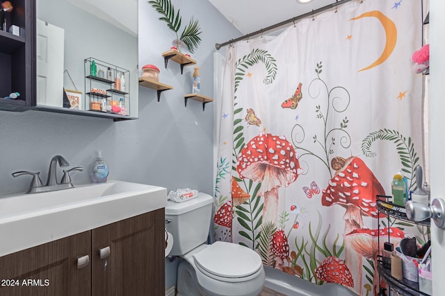 bathroom featuring vanity, curtained shower, and toilet