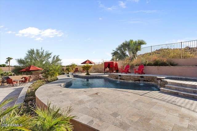 view of pool featuring a patio and pool water feature