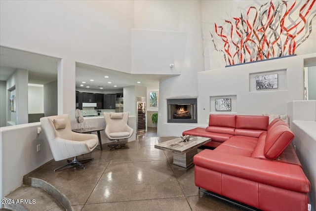 living room with a towering ceiling