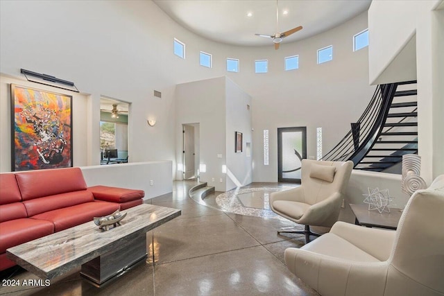 living room featuring a towering ceiling