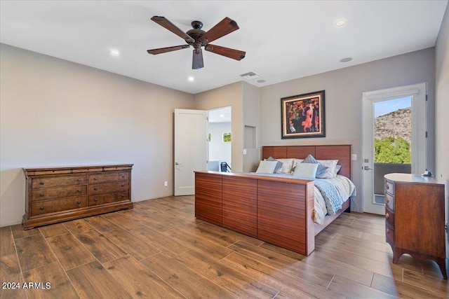 bedroom with ceiling fan and hardwood / wood-style flooring