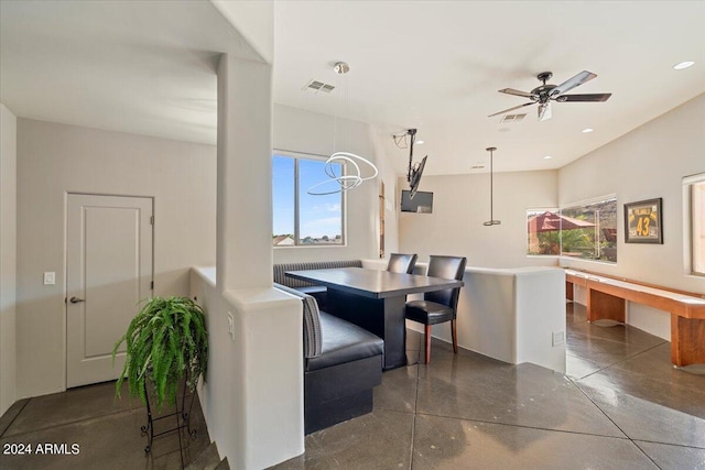 dining space with ceiling fan and a healthy amount of sunlight