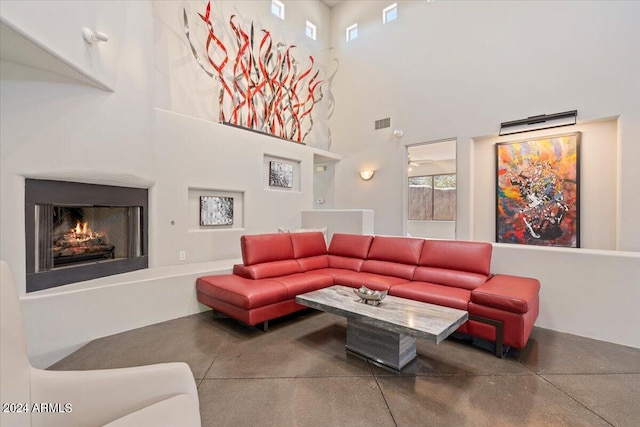 living room with a towering ceiling