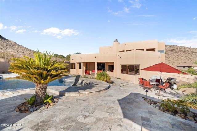 rear view of house featuring a patio area