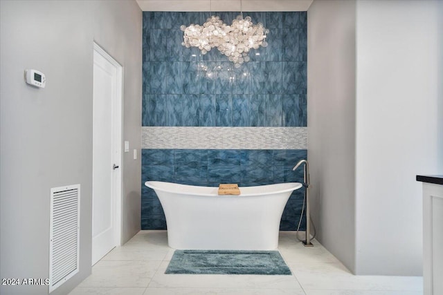 bathroom featuring a tub to relax in and tile walls