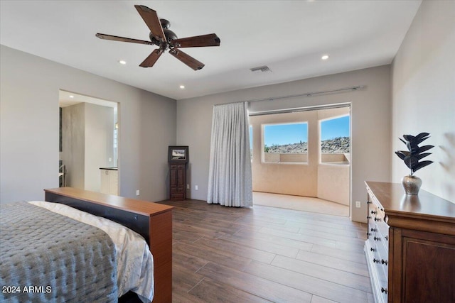 bedroom featuring ceiling fan and hardwood / wood-style floors