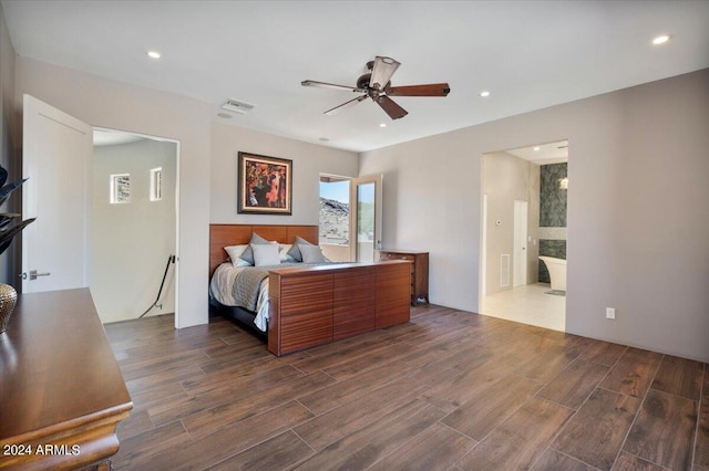 bedroom featuring ensuite bathroom, dark hardwood / wood-style floors, and ceiling fan