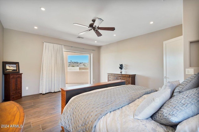 bedroom with dark wood-type flooring and ceiling fan