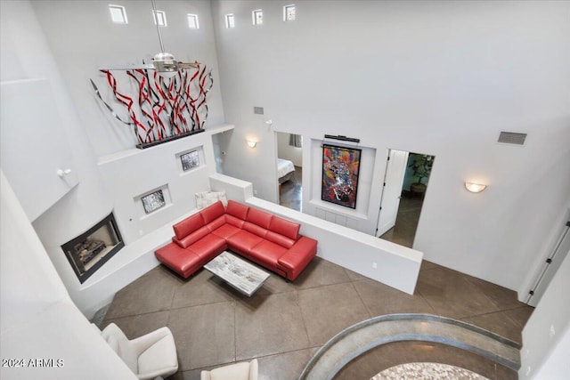 living room featuring a towering ceiling