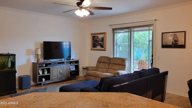 living area featuring crown molding, ceiling fan, wood finished floors, and baseboards