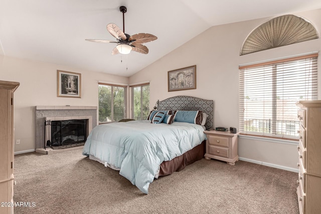 bedroom featuring light colored carpet, vaulted ceiling, and multiple windows