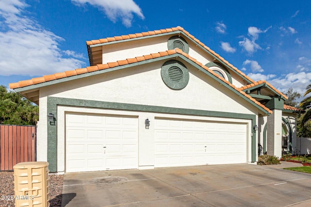 exterior space with driveway and fence