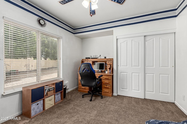 office area with baseboards, carpet flooring, ceiling fan, and ornamental molding
