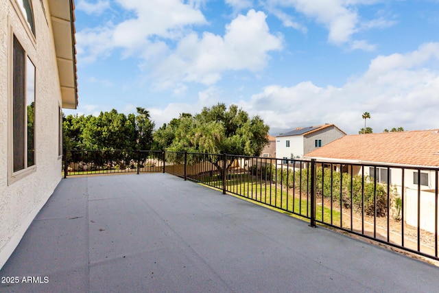 view of patio featuring a balcony