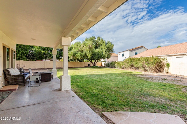 view of yard with an outdoor fire pit, a fenced backyard, and a patio area
