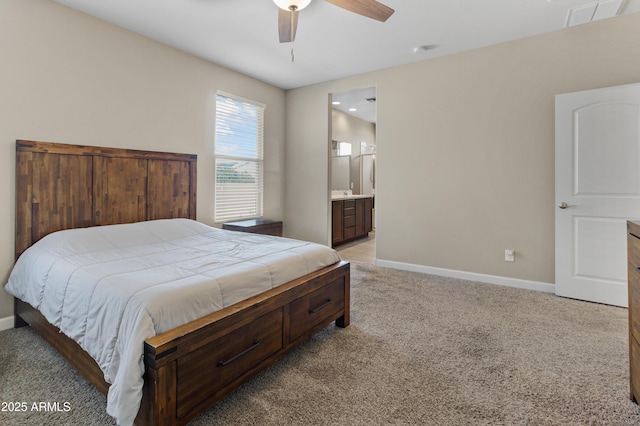 bedroom with light carpet, visible vents, baseboards, connected bathroom, and a ceiling fan