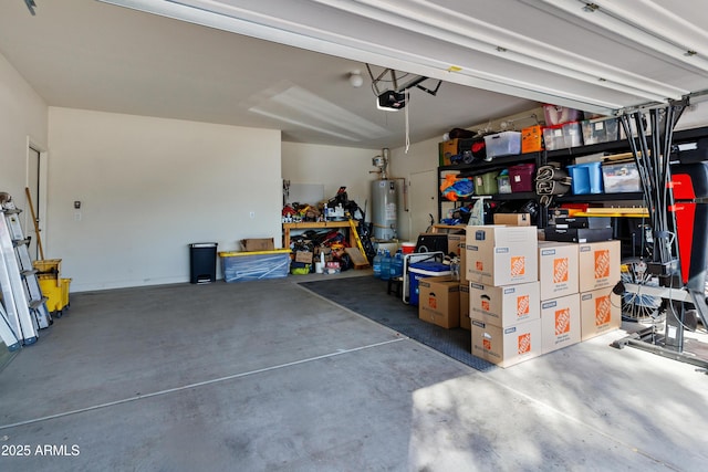 garage featuring water heater and a garage door opener