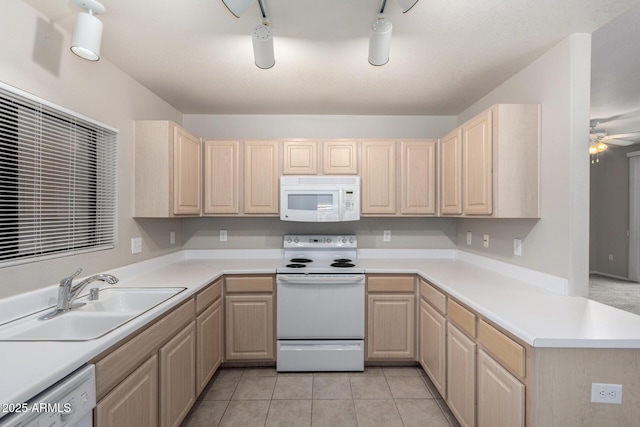 15380 N 100th St Unit 1106, Scottsdale, AZ 85260 - kitchen with white appliances, light brown cabinets, and a sink