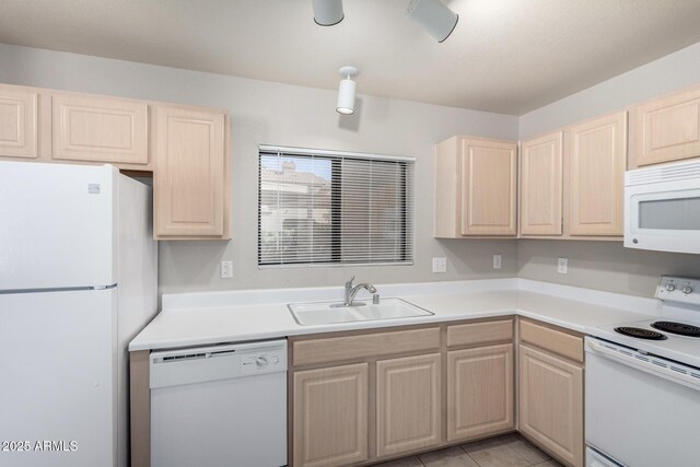 15380 N 100th St Unit 1106, Scottsdale, AZ 85260 - kitchen featuring white appliances, a sink, and light brown cabinets