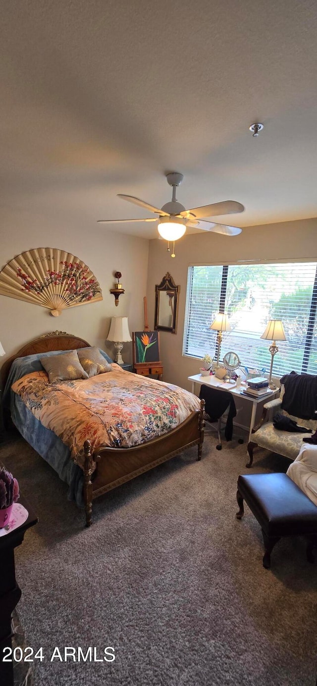 bedroom featuring carpet and ceiling fan