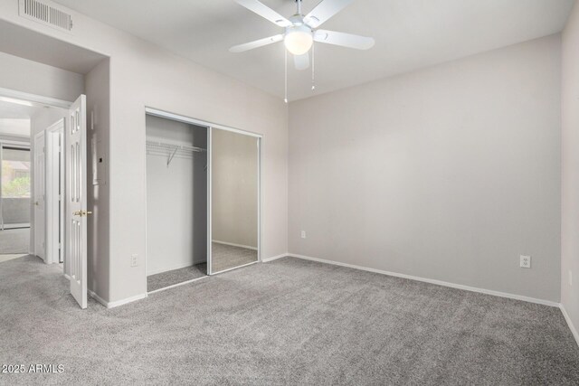 15380 N 100th St Unit 1106, Scottsdale, AZ 85260 - unfurnished bedroom featuring carpet floors, a closet, and baseboards