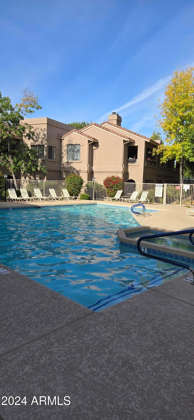 view of swimming pool with a patio area