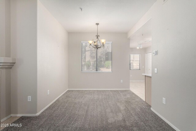 15380 N 100th St Unit 1106, Scottsdale, AZ 85260 - carpeted empty room with a chandelier, a pendent fire sprinkler, and baseboards