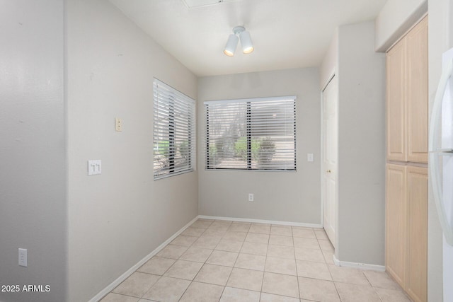 15380 N 100th St Unit 1106, Scottsdale, AZ 85260 - unfurnished room with light tile patterned flooring and baseboards