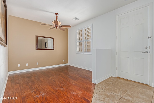 spare room with ceiling fan and light hardwood / wood-style flooring