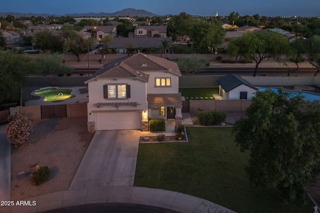 2661 E Los Alamos Ct, Gilbert, AZ 85295 - mediterranean / spanish-style home featuring stucco siding, driveway, an attached garage, a tiled roof, and stone siding