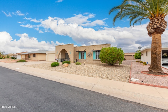 southwest-style home with a garage