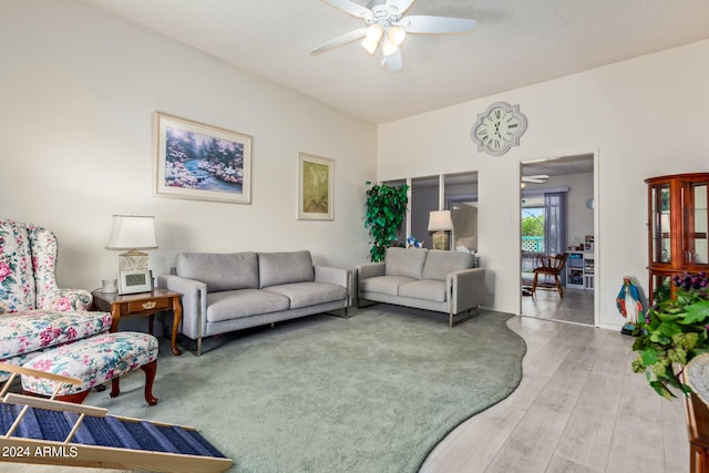 living room with hardwood / wood-style floors and ceiling fan