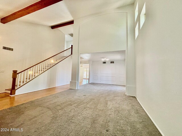 unfurnished living room featuring light wood-type flooring and ceiling fan