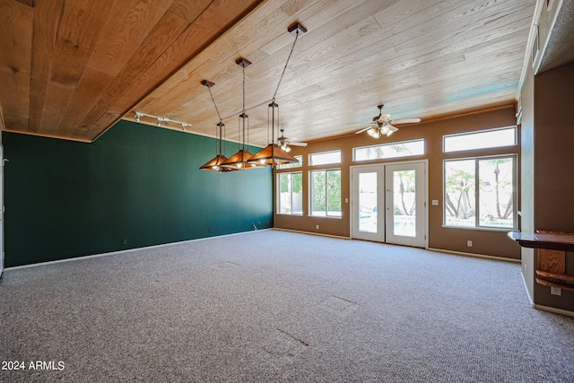 interior space with rail lighting, wood ceiling, carpet flooring, and ceiling fan