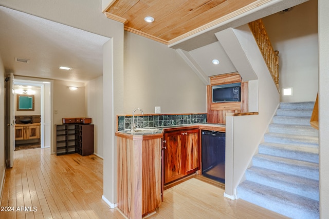 kitchen featuring decorative backsplash, sink, light hardwood / wood-style flooring, ornamental molding, and dishwasher