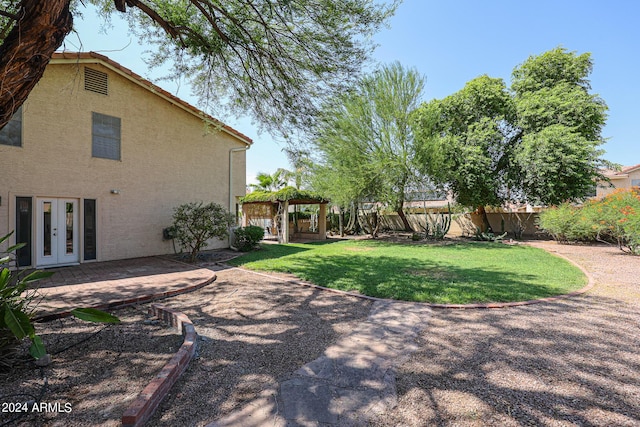 view of yard featuring french doors and a patio area