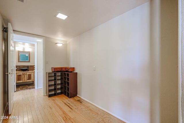 corridor featuring light hardwood / wood-style floors