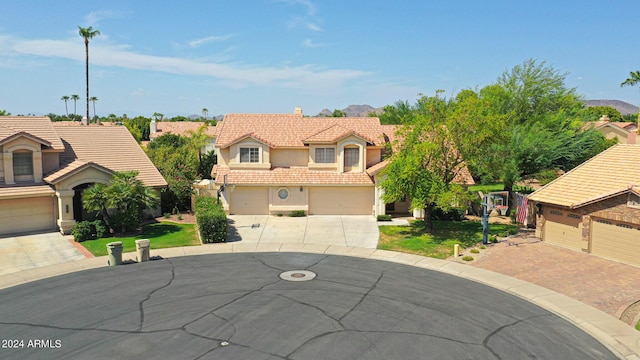 view of front of home with a garage and a front lawn