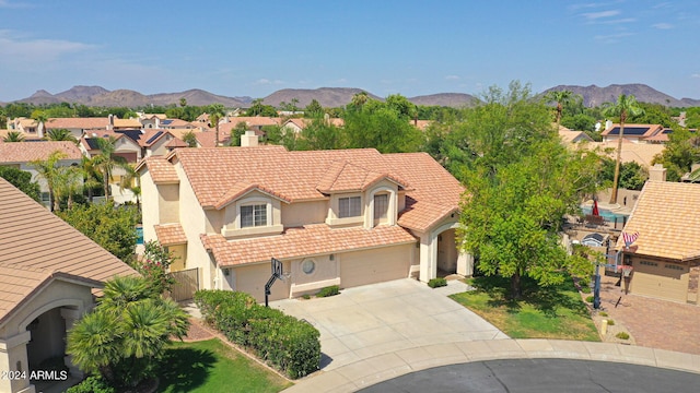 view of front of house with a mountain view and a garage