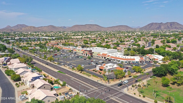 birds eye view of property with a mountain view