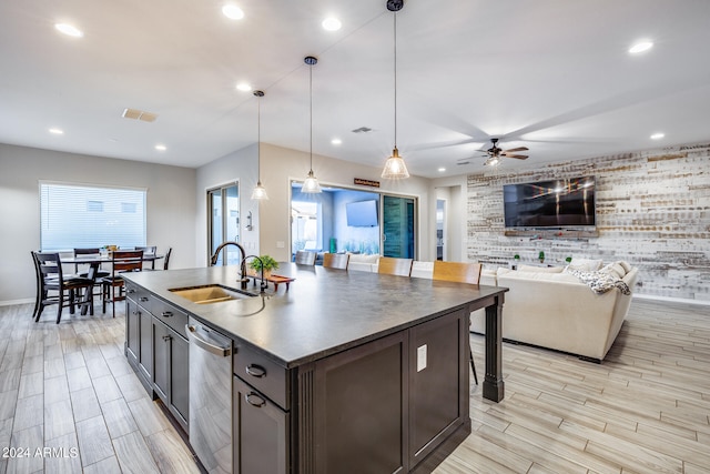 kitchen featuring ceiling fan, sink, stainless steel dishwasher, dark brown cabinets, and decorative light fixtures