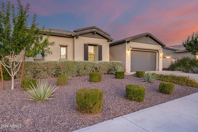 view of front of property with a garage