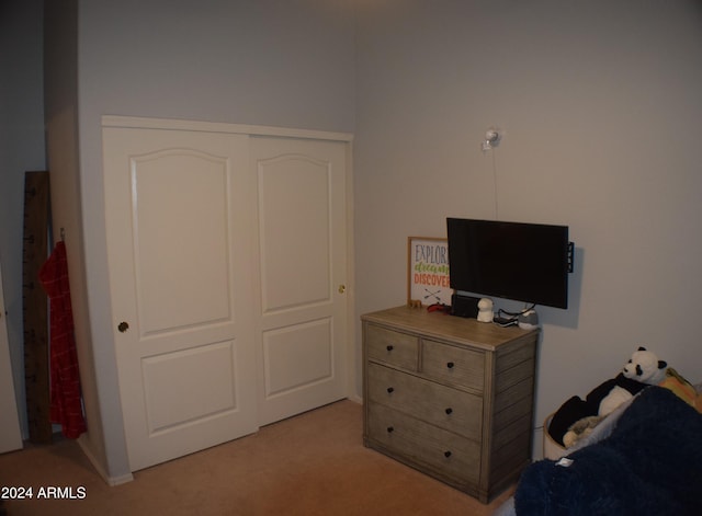 carpeted bedroom with a closet